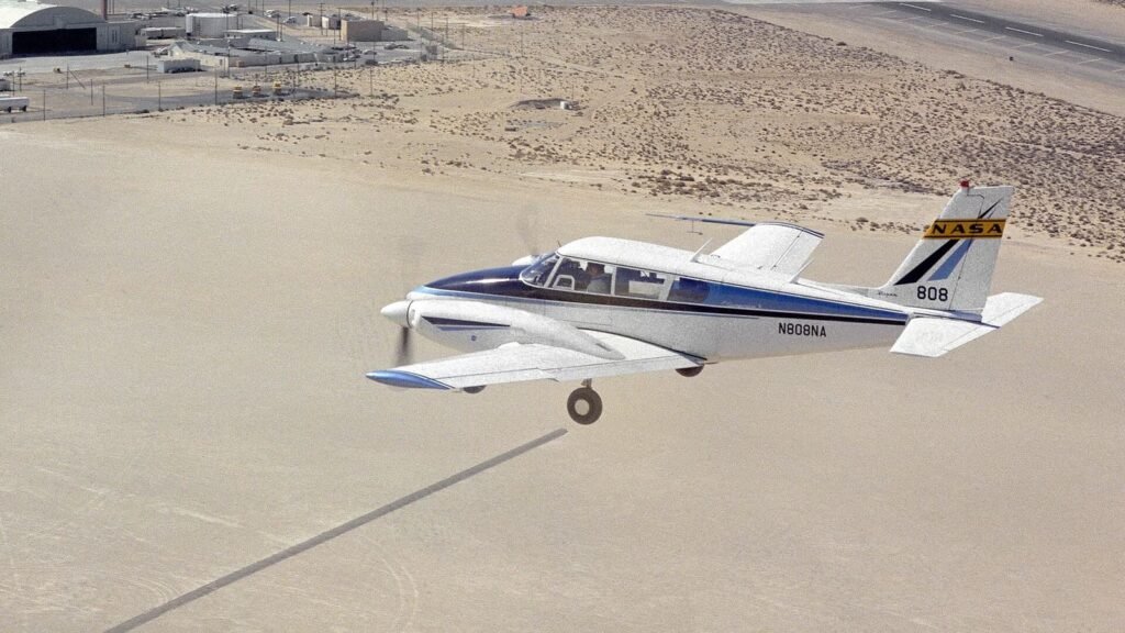 Piper Twin Comanche light twin in flight, first multiengine lesson