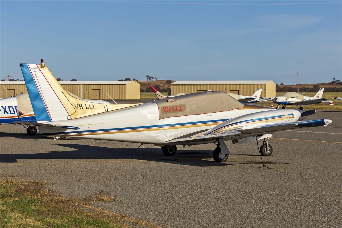 Piper Twin Comanche C/R with counter-rotating propellers parked on the ramp